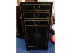 A Chinese lacquerware cabinet with three drawers &