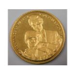 A 9ct gold proof style gold coin depicting Prince