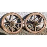 A pair of iron clad cart wheels 21in diameter