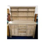 A stripped, unfinished Ercol dresser, 66.5in high