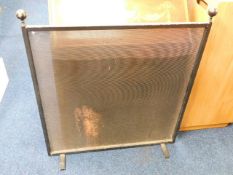 A heavy mesh fire screen 36.5in high x 32.25in wid