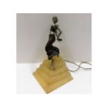 An art deco period figurative lamp with spelter fl