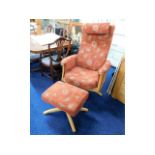 An Ercol swivel armchair with matching footstool,