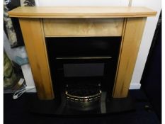 A modern fire surround & hearth with built in elec