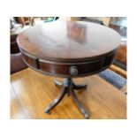 A modern Regency style mahogany drum table, 23in h