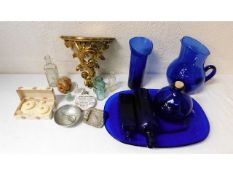 A glided wall scone, blue glassware, a retro salt