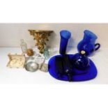 A glided wall scone, blue glassware, a retro salt