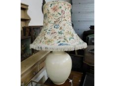 A large ceramic lamp with shade, 33in high