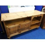 A low level pine entertainment cabinet, one handle
