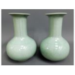 A pair of 20thC. celadon vases with foliate decor,