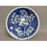 A late 19thC. Chinese blue & white prunus plate, 1