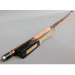 A 19thC. violin bow, 29in long, strings a/f