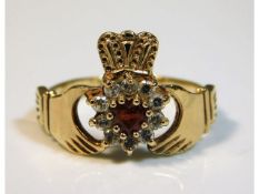 A 9ct gold ring set with diamond & heart shape cut