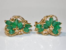 A pair of 14ct gold earrings set with marquise cut