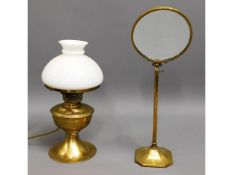 An early 20thC. brass shaving mirror twinned with