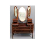 An Edwardian mahogany dressing table with six draw