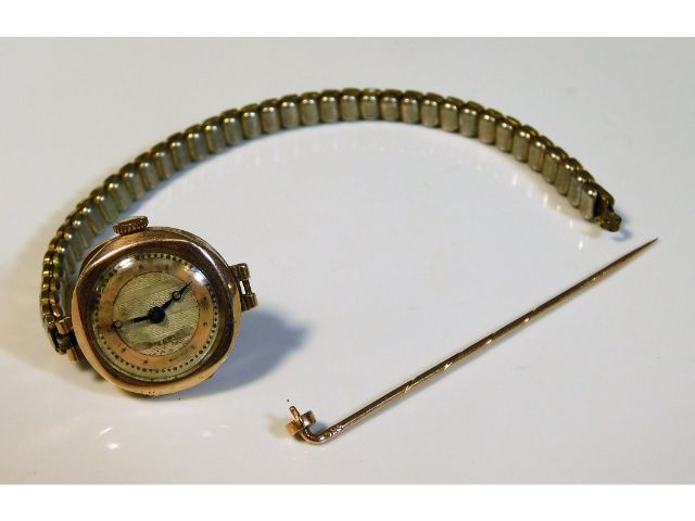 A 9ct gold ladies watch, strap a/f twinned with a