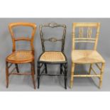 Three 19thC. dining chairs: one balloon back, cane