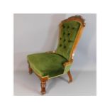 A c.1900 walnut upholstered nursing chair, 36.5in
