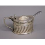 An 1892 London silver mustard by Haseler Bros. wit