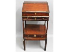 An early 19thC. three piece mahogany desk set, som