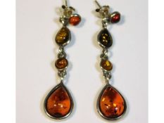 A pair of silver mounted amber drop earrings, 5.3g