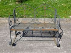 A hollow framed metal rocking garden bench, 45in w