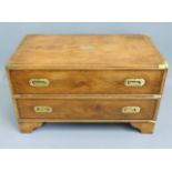 A brass bound campaign style chest of two drawers