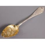 A continental silver berry spoon with gilt bowl, 8