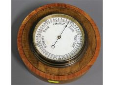 A early 20thC. walnut & mahogany mounted barometer