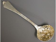 An 1838 London silver sugar sifter, 7.75in long, 7