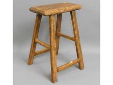 An early 19thC. elm rustic farm house stool, 21.5i