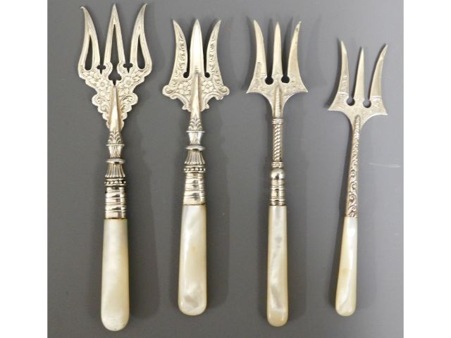 Four Victorian & Edwardian silver bread forks with MOP handles, longest 6.5in