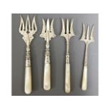 Four Victorian & Edwardian silver bread forks with MOP handles, longest 6.5in