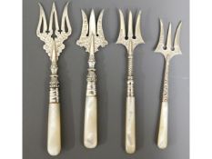 Four Victorian & Edwardian silver bread forks with MOP handles, longest 6.5in