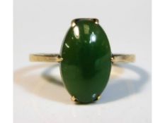 A 9ct gold ring set with jade, size N, 2.2g