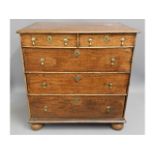 An oak William & Mary chest of drawers on bun feet