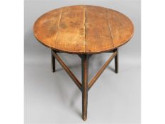 An 18thC. George III elm cricket table, approx. 33