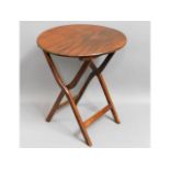 A Victorian circular mahogany coaching table, spli