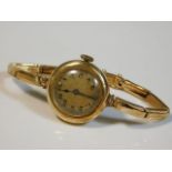 A ladies 14ct gold case & strap wrist watch, 18.7g