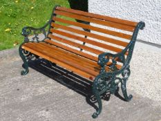 A modern garden bench with cast iron ends, 49.5in