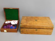 An antique mahogany box with bow ties twinned with