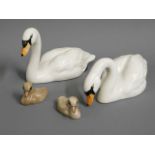 A Beswick swan & cygnet set, tallest 2.75in