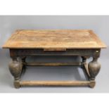 A 16thC. Elizabethan draw leaf oak refectory table with fruit & vine carving to legs (extensions not