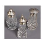 Three early 20thC. silver topped glass sugar caste