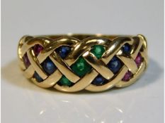 A 9ct gold ring with lattice design set with ruby,