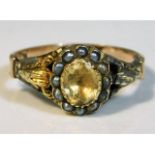 A 19thC. yellow metal ring, tests as 9ct, set with