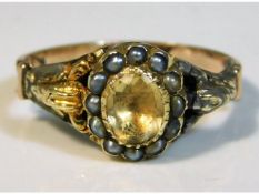 A 19thC. yellow metal ring, tests as 9ct, set with