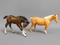 Two Beswick horses, tallest 4.75in, Palomino has t