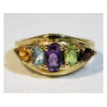 A 9ct gold ring set with citrine, topaz, amethyst,